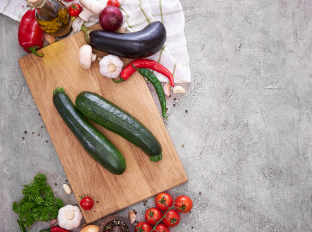 istock zucchini on wooden cutting board and vegetables at domestic kitchen 1456741603
