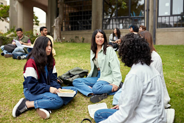 istock College students enjoying lunch break outdoors 1456745802