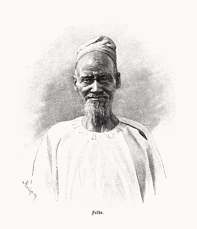 A man of the Fula, Fulani, or Fulɓe people - member of a people living in a region of West Africa from Senegal to northern Nigeria and Cameroon. They are traditionally nomadic cattle herders of Muslim faith. Nostalgic scene from the past. Wood engraving, published in 1899.