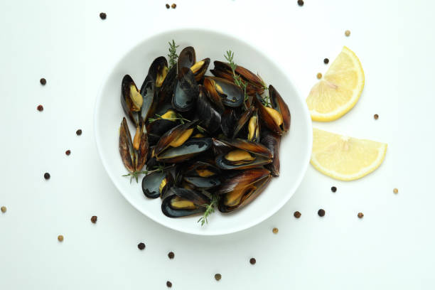 istock Plate with fresh mussels on white background 1456756477