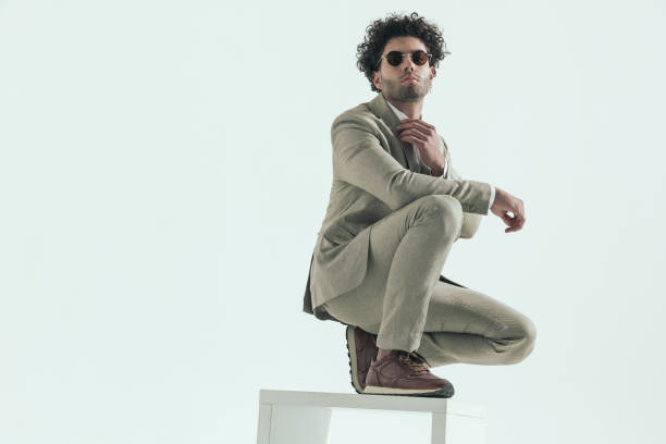 istock confident lebanese businessman adjusting suit and crouching 1456757349