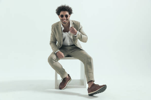istock handsome lebanese man with glasses adjusting suit and laughing 1456757518