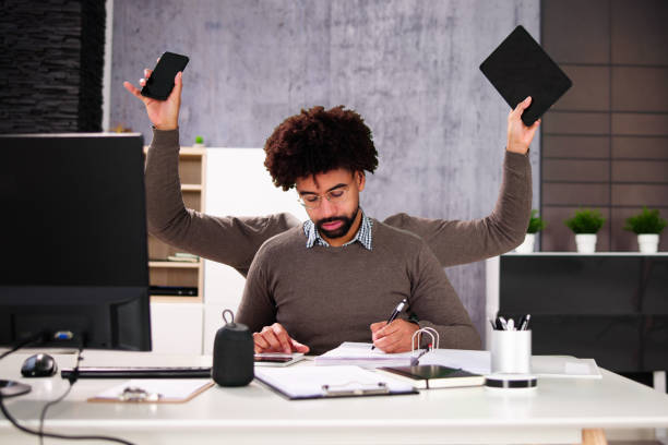 istock Happy Busy Business Man Multitasking 1456757774