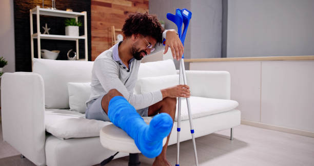 istock Broken Leg In Cast Recovery. Man With Injury 1456759319