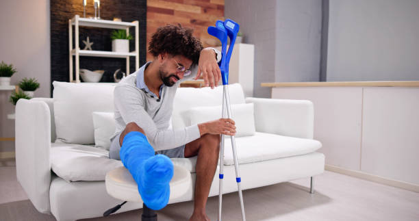 istock Broken Leg In Cast Recovery. Man With Injury 1456759321