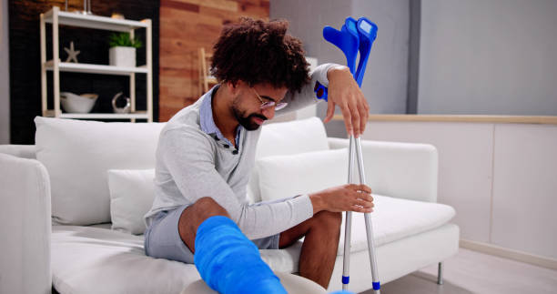 istock Broken Leg In Cast Recovery. Man With Injury 1456759322