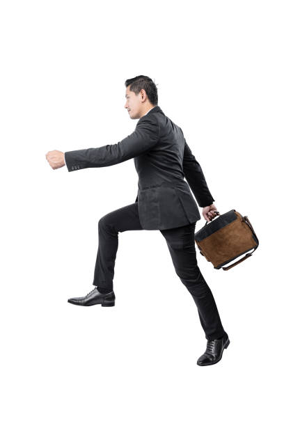 istock Asian businessmen walking while carrying briefcases 1456759891