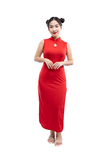 Asian Chinese woman in a cheongsam dress standing isolated over white background