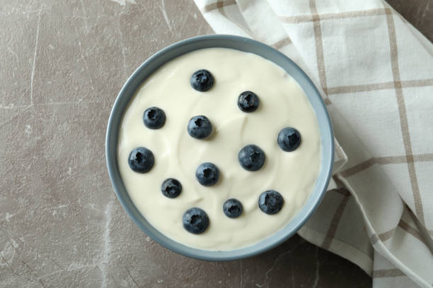 istock Concept of tasty breakfast with yogurt on gray textured table 1456761205