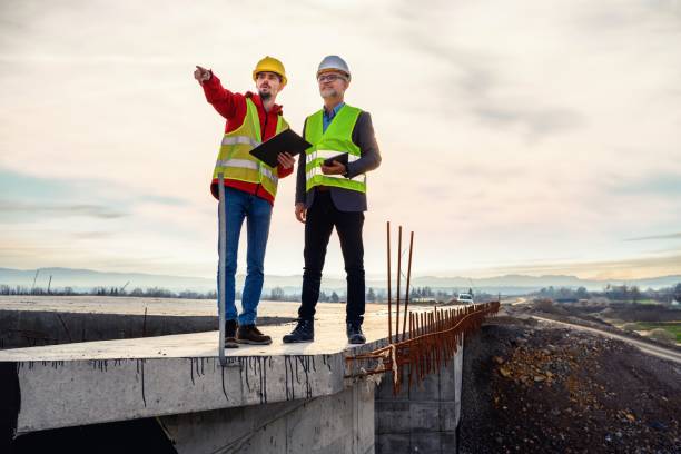 Engineer and investor on a road construction site