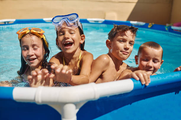 istock Children games in swimming pool 1456762110