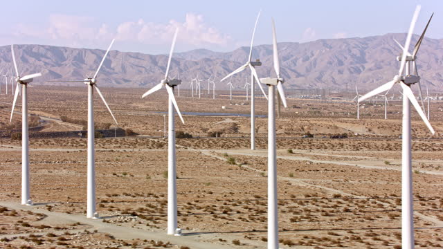 AERIAL Windmills near sunny Palm Springs, CA