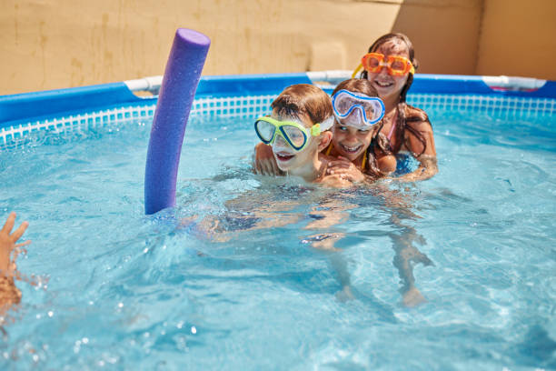 istock Children games in swimming pool 1456762327