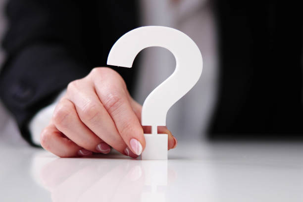 istock Businessperson's Hand Holding Red Question Mark 1456762351