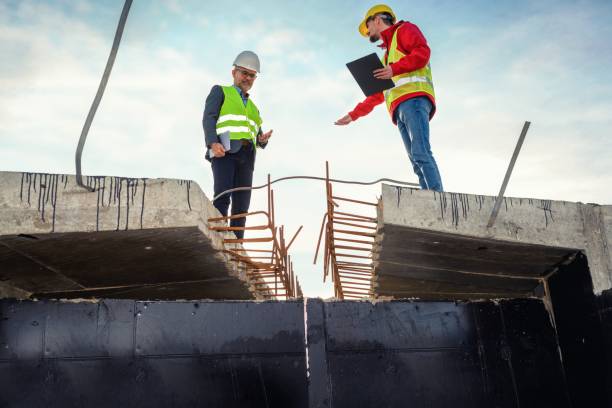 istock Engineer and investor on a road construction site 1456765067