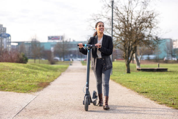 istock Young Adult Hispanic Female Using An Electric Scooter 1456765618