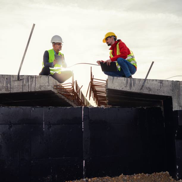 istock Engineer and investor on a road construction site 1456766907