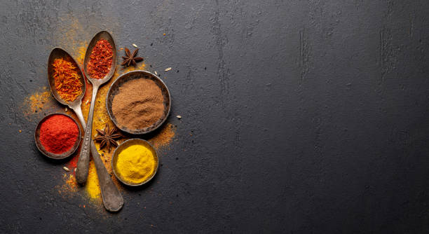istock Various spices in bowls and spoons on stone table 1456768353