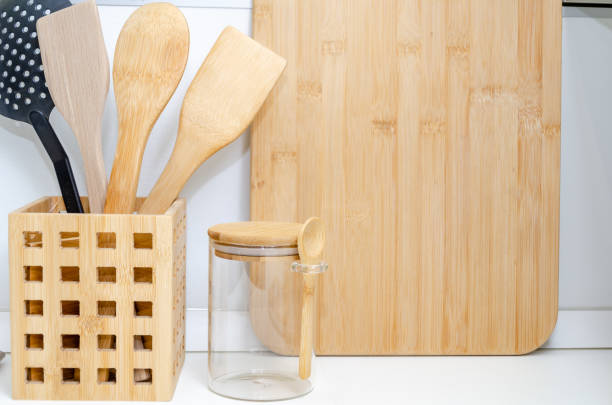 istock Eco friendly Bamboo kitchen utensils on kitchen table. wooden and plastic spatulas for cooking 1456768452
