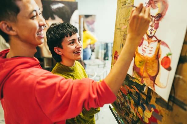 istock Multiracial students painting inside art room class - Focus on girl face 1456773764