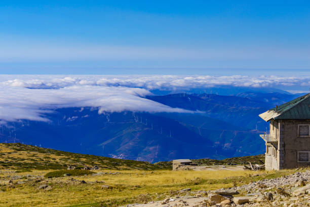 istock Wind turbines above clouds in Serra da Estrela, Portugal. 1456777393