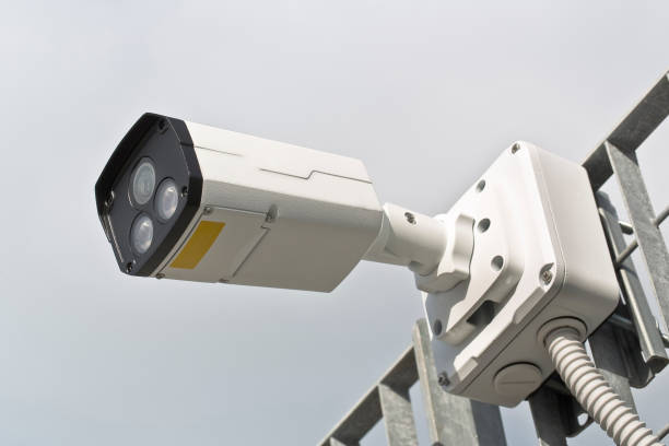 istock Security Camera against a metal grid for the security control of urban spaces 1456779670