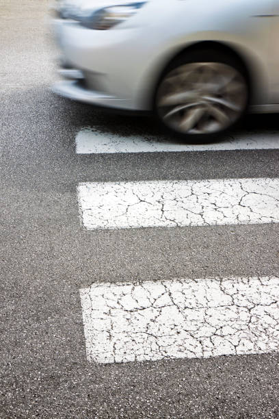 istock Black and white pedestrian crossing with car on background. 1456780381