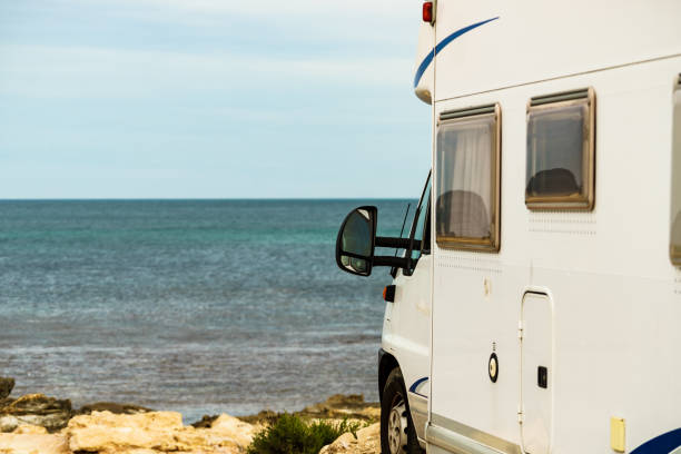 istock Camper on beach seashore. Holidays trip. 1456780560