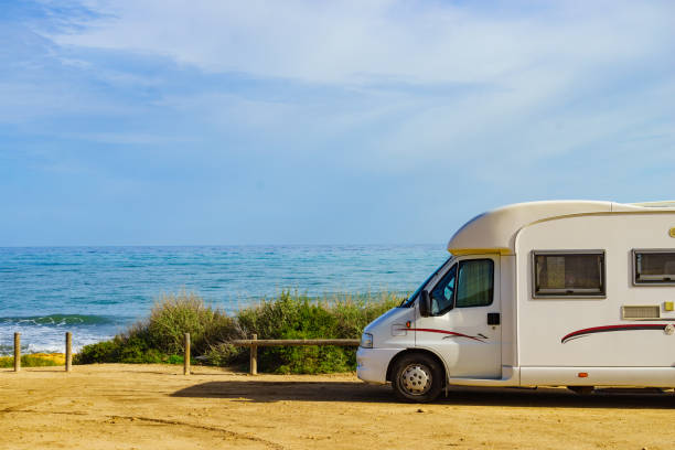 istock Camper on beach seashore. Holidays trip. 1456780645
