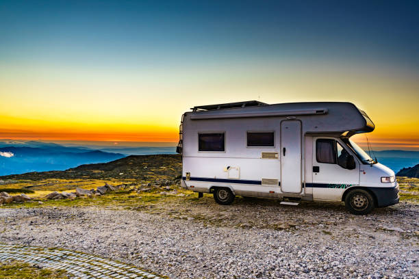 istock Rv camper in mountains above clouds at sunset 1456781113