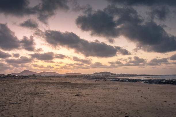 The amazing Famara beach on the Atlantic Ocean in Lanzarote, Canary Islands,  Spain The amazing Famara beach on the Atlantic Ocean in Lanzarote, Canary Islands, Spain caleta de famara lanzarote stock pictures, royalty-free photos & images