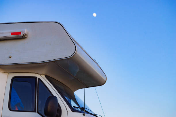 istock Rv caravan against evening sky with moon 1456782129