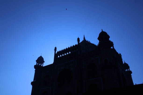 istock A stunning silhouette of the Red Fort during a deep red sunset. 1456782134