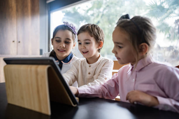 istock Children Playing Video Game Using Digital Tablet At Home 1456783680