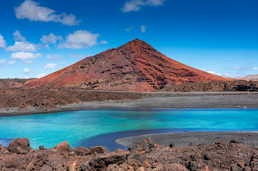 Sulfur lake in front of a volcano in Lanzarote, Canary Islands, Spain