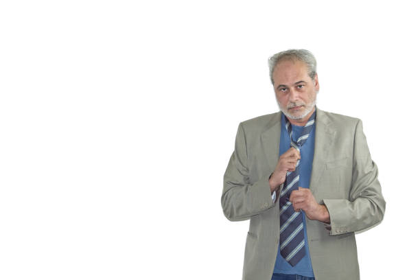 man with a beard and a suit posing on a white background