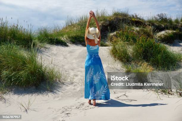 A Girl On A Sandy Beach In Denmark Stock Photo - Download Image Now - Summer, Long Dress, One Woman Only