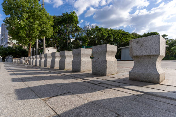 stone barriers on the sidewalk that blocks traffic