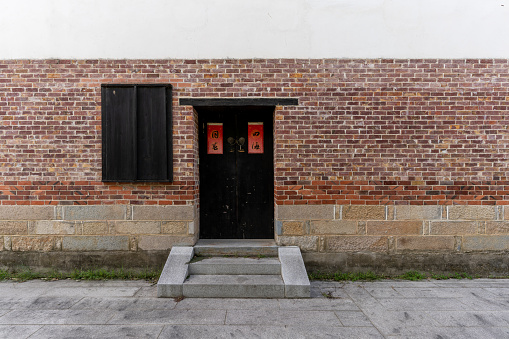 The door and window of Chinese architecture with red brick walls