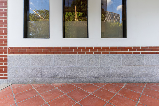 New Chinese architecture with white wall, red bricks and plastic glass windows