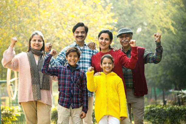 istock Happy multi-generation family with raised fists at park 1456792387