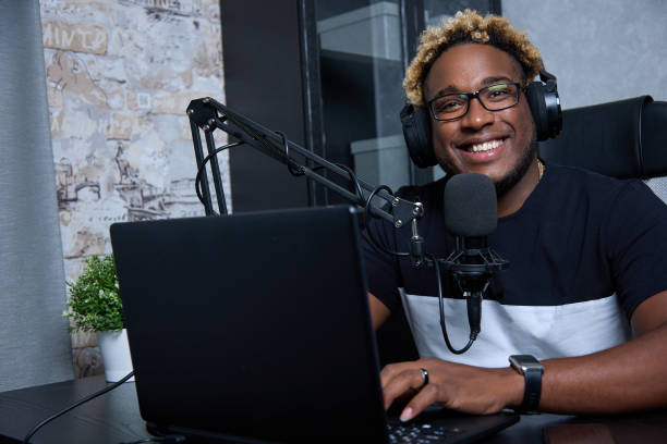 istock Radio DJ with glasses leads a popular program for listeners 1456793959