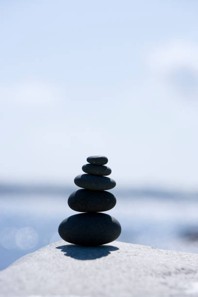 istock Stone pyramid in balance with out of focus background 1456794507