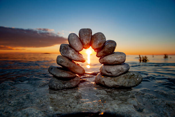 istock Stone arch in the water with horizon over water 1456795051