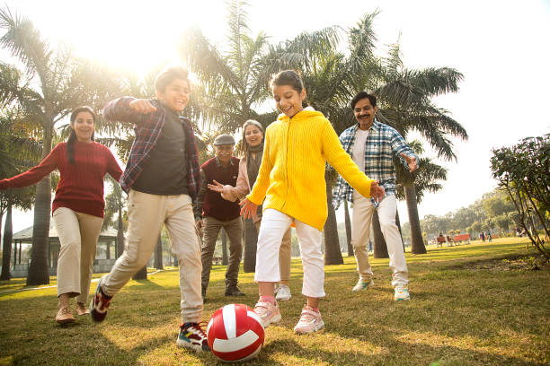 istock Multi generation family playing soccer at park 1456795135