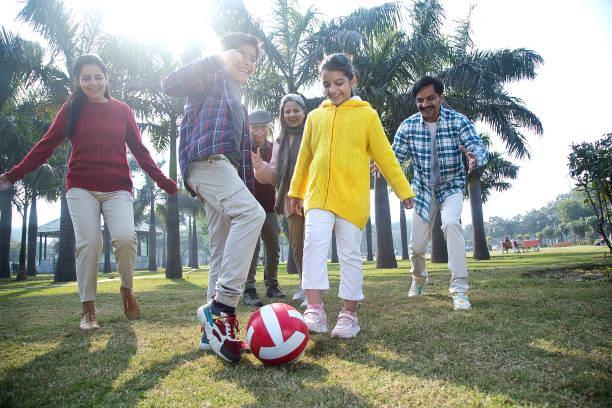 istock Multi generation family playing soccer at park 1456795693
