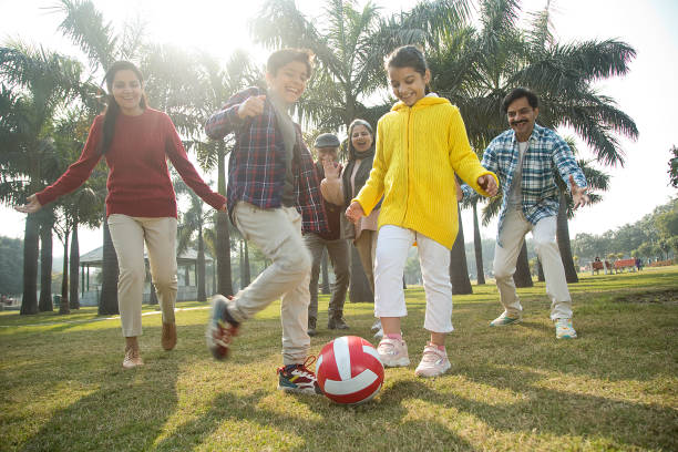 istock Multi generation family playing soccer at park 1456795832