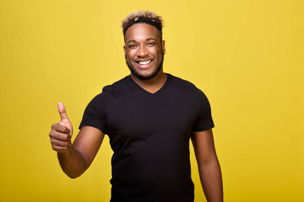 istock Satisfied young man shows positive hand gesture, he is satisfied with everything 1456796720