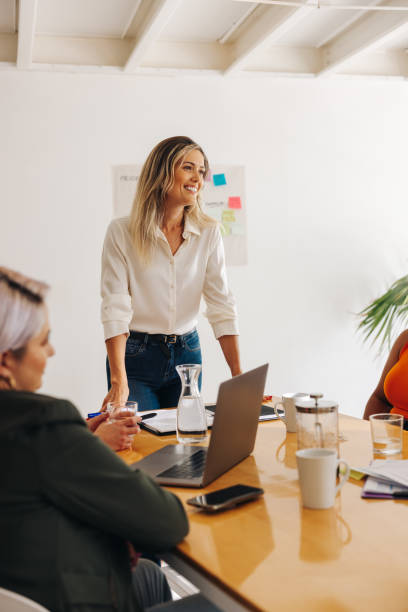 istock Happy team leader having a meeting with her colleagues 1456796734
