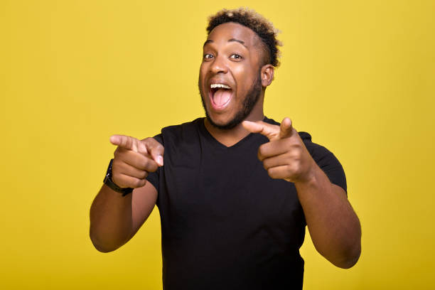 istock Happy young man with a smart watch points his index finger at the camera 1456796956